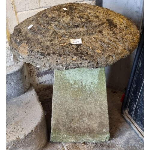 A pair of mushroom shaped staddle stones, the bases later ce...