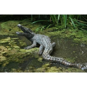 A patinated bronze model of a crocodile