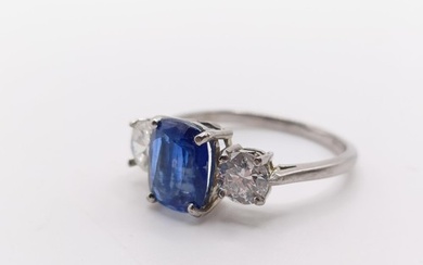 A platinum, sapphire and diamond three stone ring, ring size...