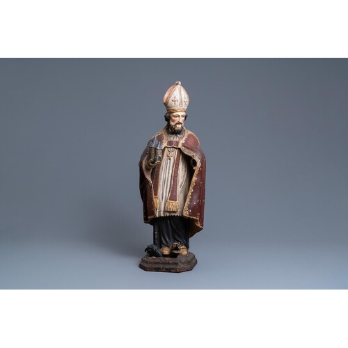 A polychromed wooden figure of Saint Amand, 17th C.H.: 85 cm...