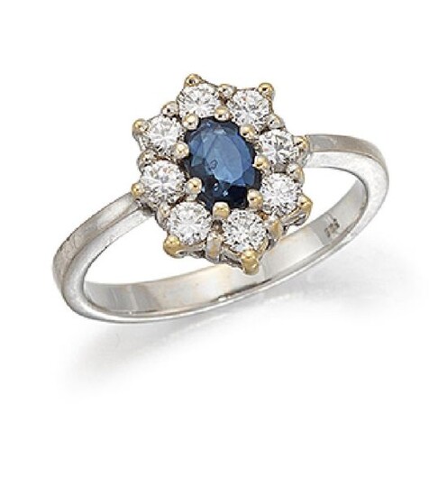 A sapphire and diamond cluster ring, the claw-set...