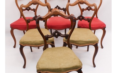 A set of six Victorian walnut dining chairs - the shaped, wa...