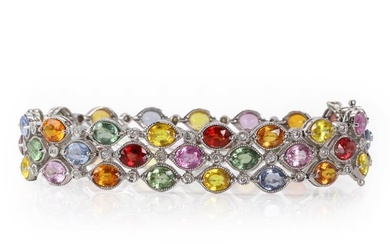 A white gold, three row varicoloured sapphire and diamond bracelet