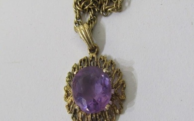 AMETHYST PENDANT, large oval amethyst set in a 9ct yellow go...