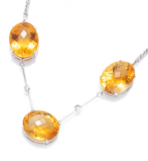 AN 18CT WHITE GOLD CITRINE AND DIAMOND NECKLACE; set in line with 3 oval cut chequerboard citrines totalling approx. 31.00cts with 2...