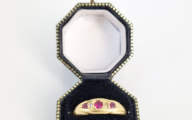 AN 18ct YELLOW GOLD THREE RUBY AND TWO DIAMOND RING
