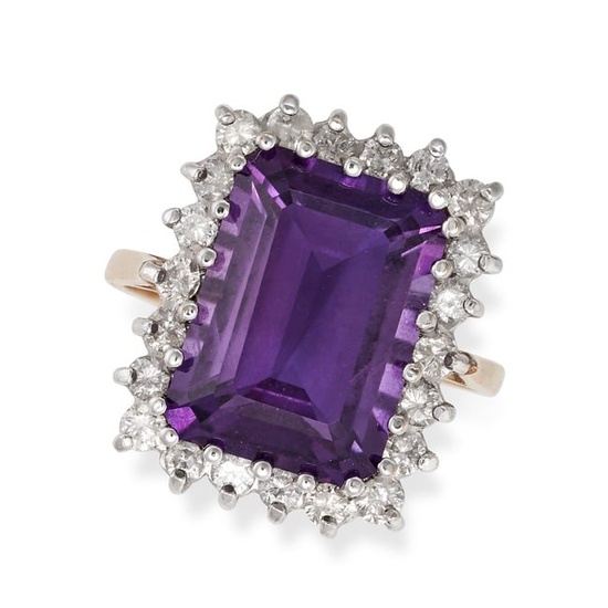 AN AMETHYST AND DIAMOND CLUSTER RING in 9ct yellow gold, set with an octagonal step cut amethyst in