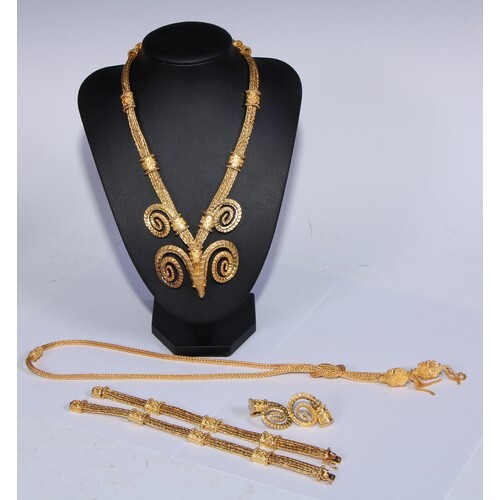 An 18ct gold metamorphic stylised ram mask necklace and belt...