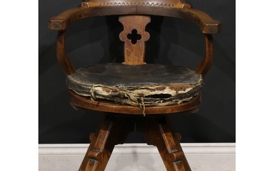 An Arts & Crafts oak swivel desk chair, possibly James Shool...