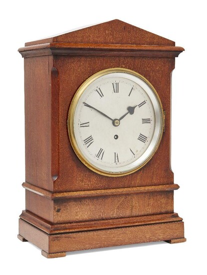An Edward VII mahogany cased fusee mantel timepiece, circa 1905, the architectural case with chamfered sides over plinth base, marked to reverse with E.R. VII and crown, the silvered circular dial with Roman numerals and black spade hands, having...