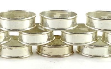 An associated set of twelve Elizabeth II oval silver...