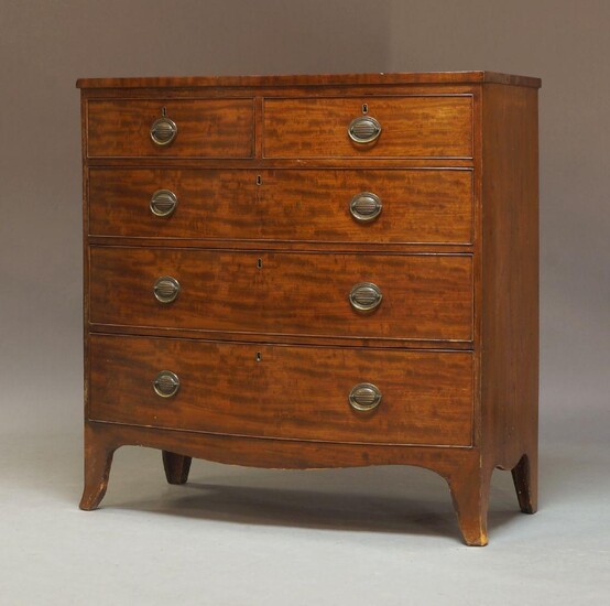 An early Victorian bow fronted mahogany chest of drawers, circa 1840, fitted with two short drawers over three long graduated drawers, all with beaded edges, raised on splayed bracket feet, measuring 106cm high, 104cm wide, 53cm deep