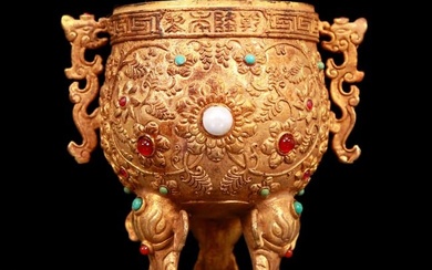 An exquisite gilt bronze cup with double ears, tripod and dragon pattern inlaid with gems