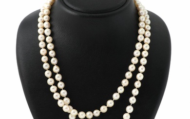 An opal and pearl necklace set with numerous cultured pearls and a...
