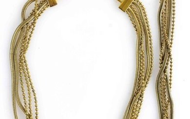 Christian DIOR - Parure en métal doré avec chaînes perlées et tubogaz comprenant un collier...