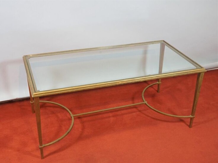 Coffee table, the structure in gilt bronze, resting on 4 legs joined by a spacer, the glass top, circa 1960