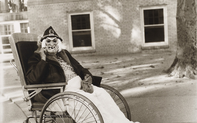 DIANE ARBUS (1923–1971) Masked woman in a wheelchair, PA, 1970