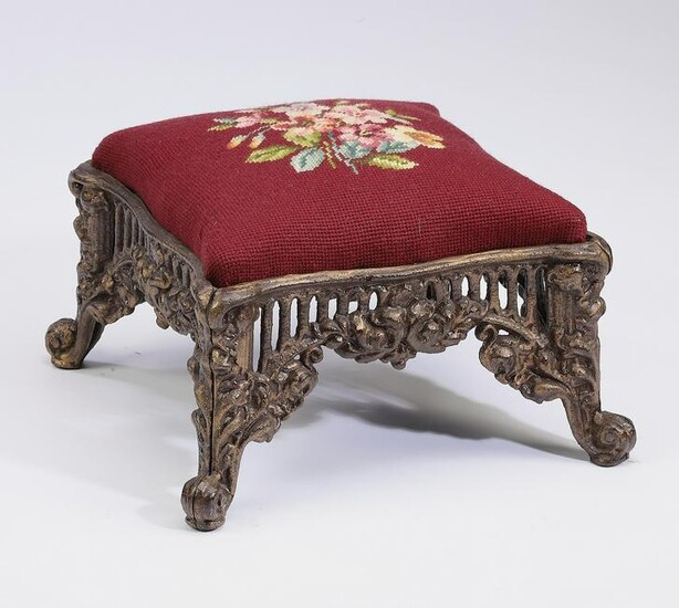 Early 20th c. cast iron and needlepoint footstool