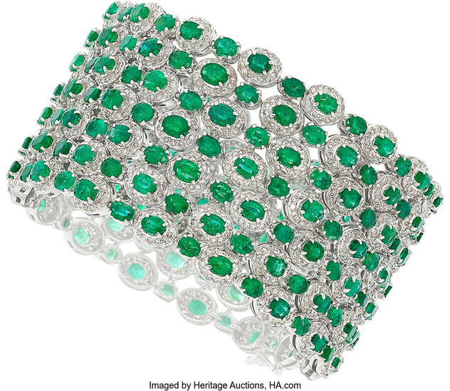 Emerald, Diamond, White Gold Bracelet Stones: Oval-shaped emeralds weighing...