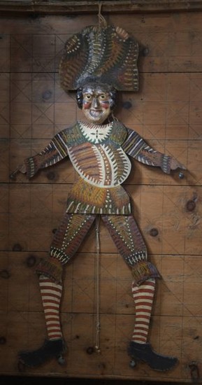 Life-size puppet with articulated arms and legs moved...