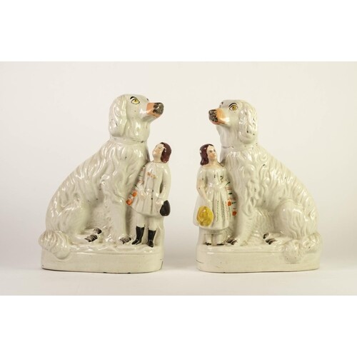 PAIR OF VICTORIAN STAFFORDSHIRE MANTLE DOG POTTERY GROUPS, e...