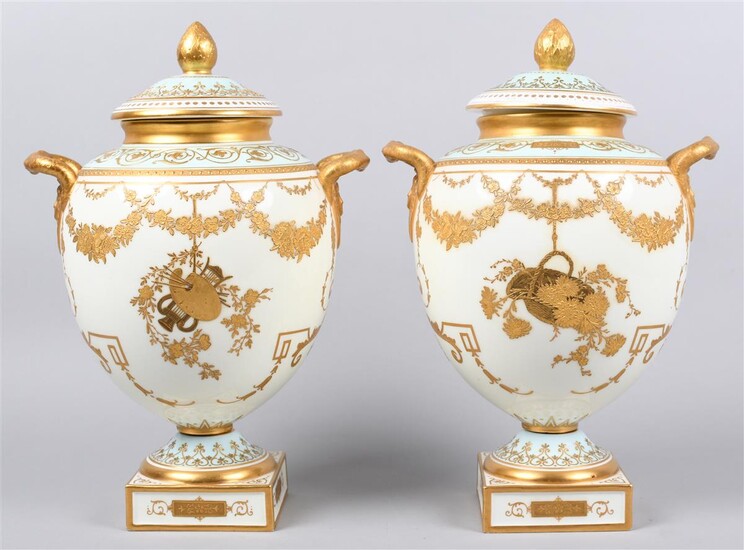 PAIR OF WEDGWOOD â VICTORIA WAREâ PALE-BLUE AND IVORY-GROUND TWO-HANDLED VASES AND COVERS