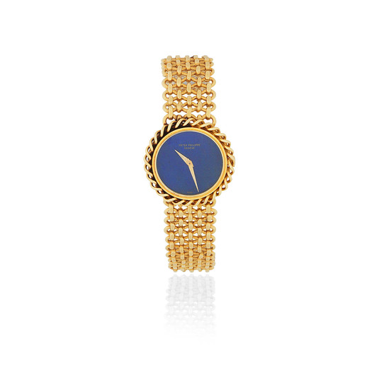 Patek Philippe. A lady's 18K gold manual wind bracelet watch with lapis lazuli dial