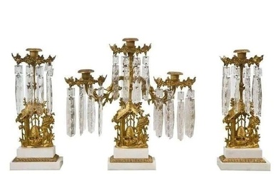 Set of three French Belle Époque style gilt-metal candelabras, the center piece has three arms, the