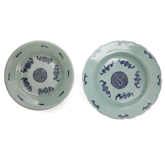 Two Chinese porcelain plates, decorated in blue with Buddhist symbols and ornamentation...