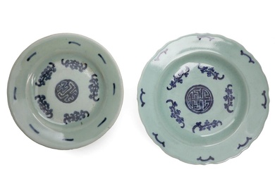 Two Chinese porcelain plates, decorated in blue with Buddhist symbols and ornamentation...