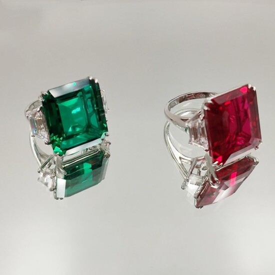 Two RINGS in 14 karat white gold (585‰) set with white, green and red imitation stones, cut in steps.