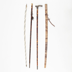 Two canes with rod in tortoiseshell and handles in gold and silver and two canes with rod in ivory simile and leather simile, early 20th Century.