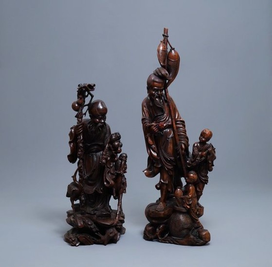 Two large Chinese carved wood figures of immortals,...