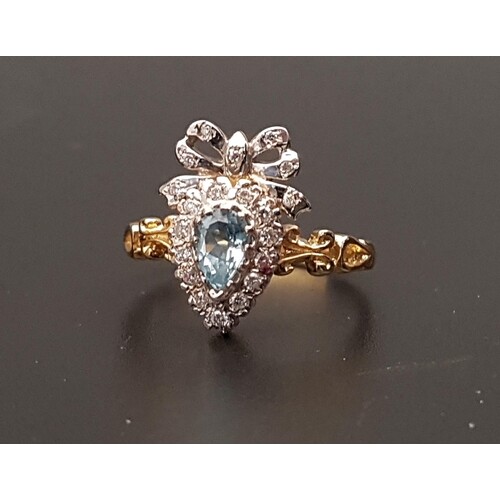 UNUSUAL BLUE TOPAZ AND DIAMOND CLUSTER RING the pear cut top...