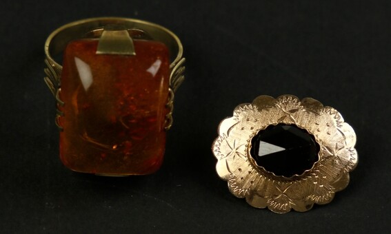 14k yellow gold brooch set with a rose-cut garnet, and...