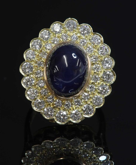 An 18ct gold sapphire and diamond oval cluster ring
