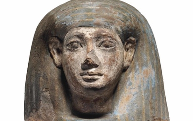 AN EGYPTIAN POLYCHROME PAINTED CANOPIC JAR LID, NEW KINGDOM, CIRCA 1550-1070 B.C.