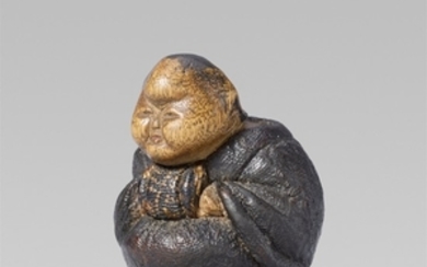 An unusual and small lacquered wood netsuke o ...
