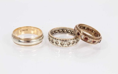 9ct yellow and white gold wedding ring, 9ct gold gem set eternity ring and a 9ct gold and silver gem set eternity ring (3)