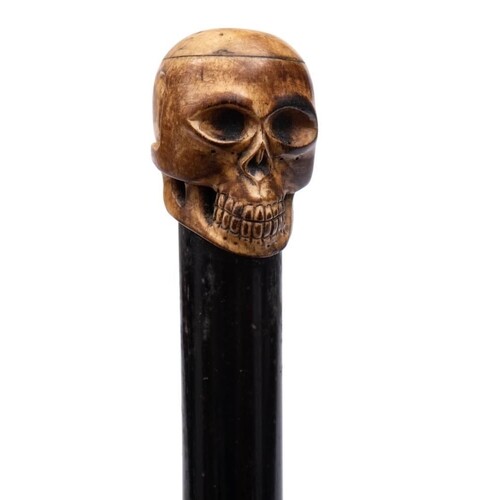 A 19th century marine ivory carved skull walking cane: mount...