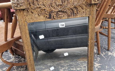 A BEVELLED GLASS RECTANGULAR MIRROR IN A REGENCY GILT FRAME WITH FLUTED COLUMN SIDES CRESTED BY