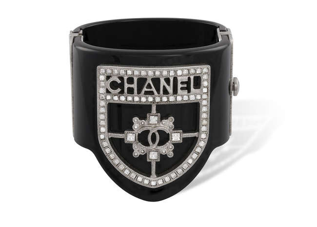 A BRACELET CUFF, BY CHANEL The large cuff...