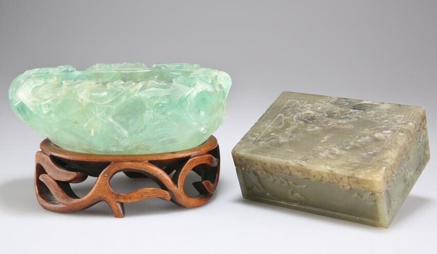 A CHINESE CARVED FLUORITE BOWL, carved with prunus, to