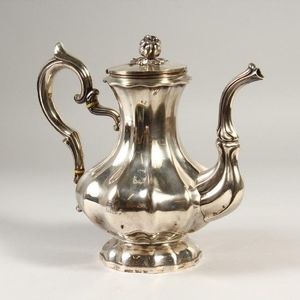 A CONTINENTAL SILVER COFFEE POT. Crested.
