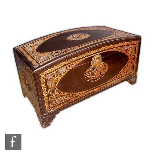 A Chinese Camphor wood chest, raised on four carved supports...