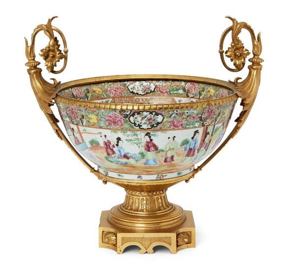 A Chinese Canton porcelain punch bowl with ormolu mounts, 19th century, painted in famille rose enamels with figures in a garden landscape, 36cm high x 36cm wide