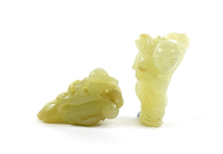 A Chinese Jade Carving of a Fruit, 5.5cm long; and...