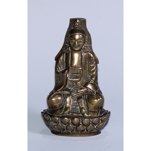 A Chinese bronze Buddha, seated in meditation, upon a lotus,...