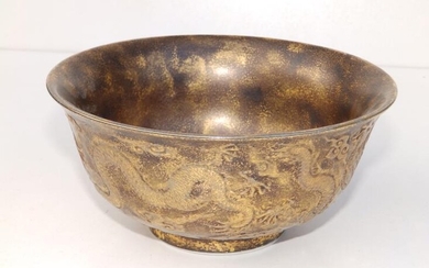 A Chinese porcelain bowl with gold sponged decoration overall,...