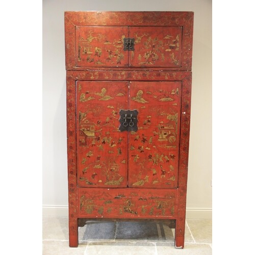 A Chinese red lacquer chinoiserie two piece cabinet, early 2...